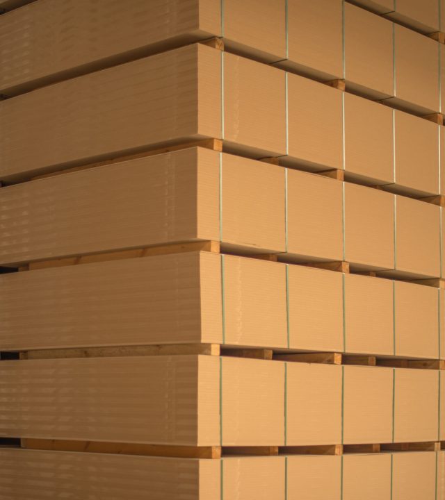 The stack of MDF boards tied with ribbon in stock.